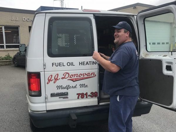 service technician in front of van